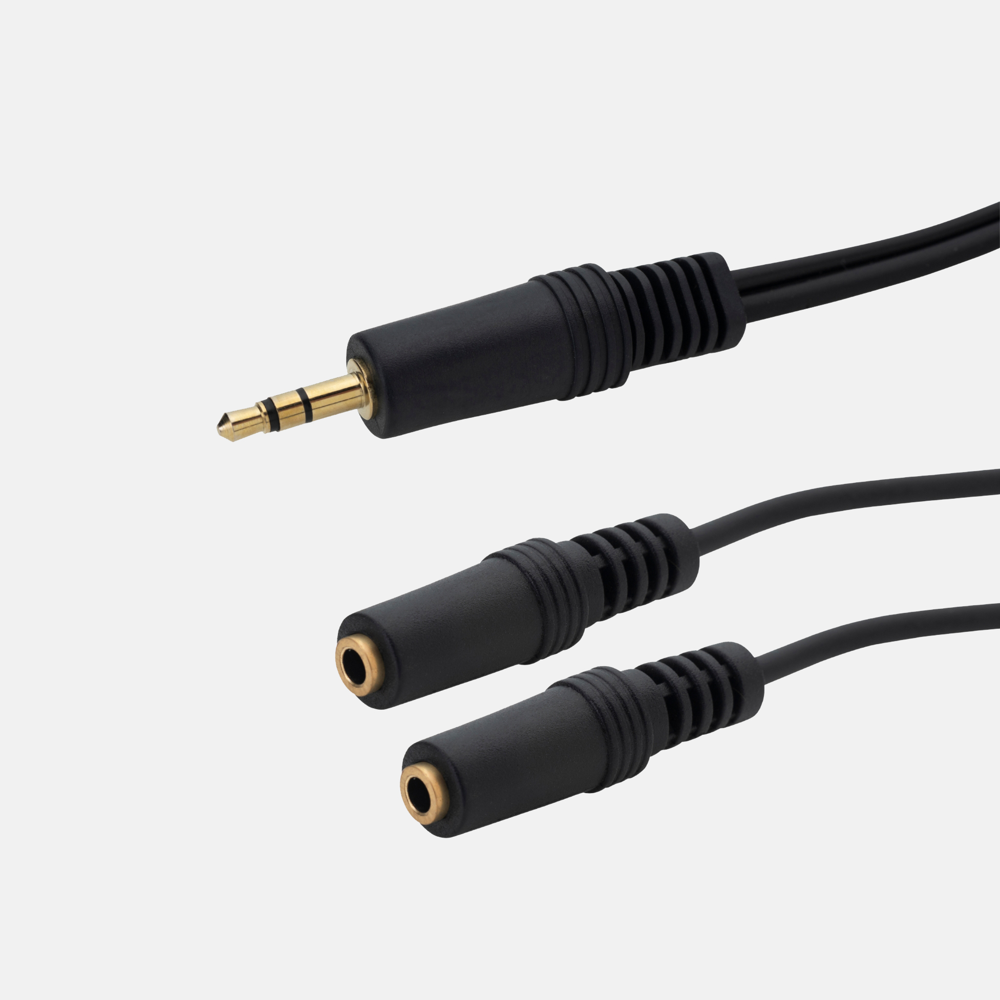 A black 3.5mm stereo jack splitter cable with a male gold plated connector and two black 3.5mm stereo jack connector cables with two female gold plated connectors