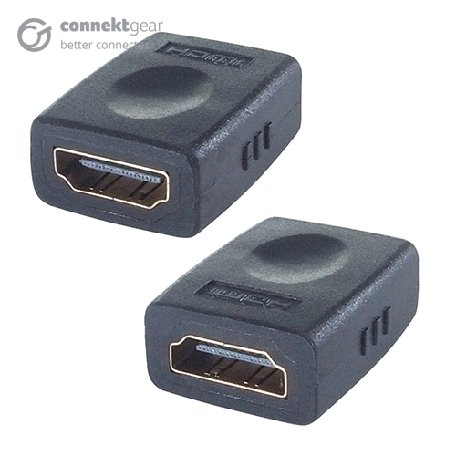 A HDMI coupler with two HDMI female ports both housed in a plastic casing with 'HDMI' bevelled on the top of the device, the HDMI ports are on oposite sides to eachother