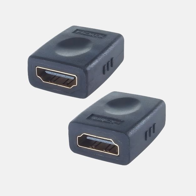 A HDMI coupler with two HDMI female ports both housed in a plastic casing with 'HDMI' bevelled on the top of the device, the HDMI ports are on oposite sides to eachother